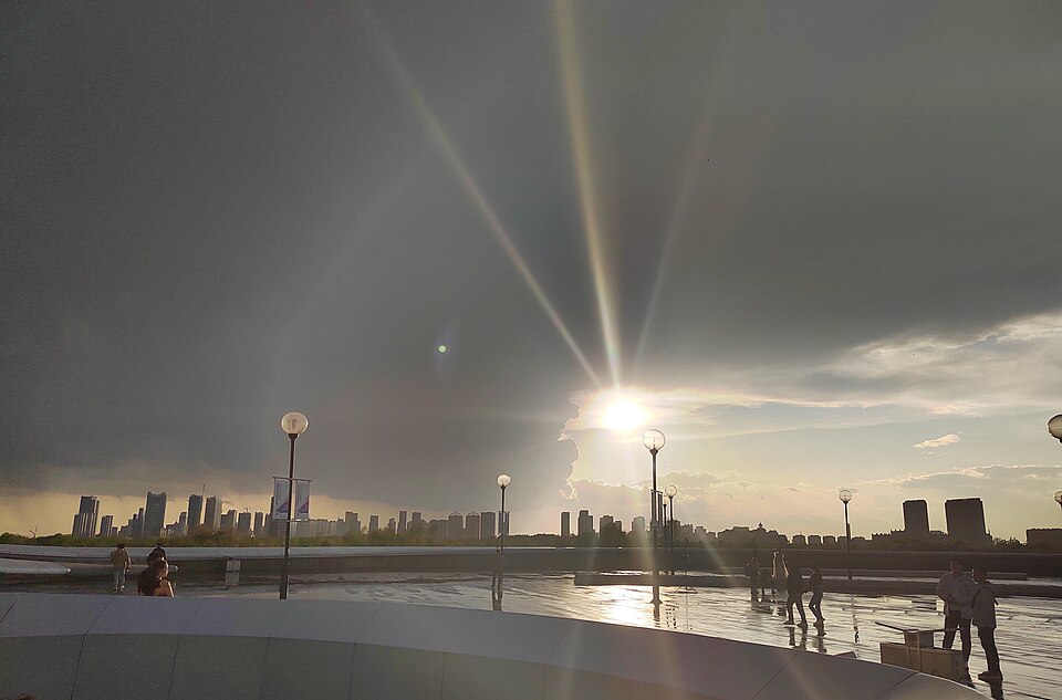 Harbin Opera House in China with its sweeping curved forms integrated into the surrounding landscape.