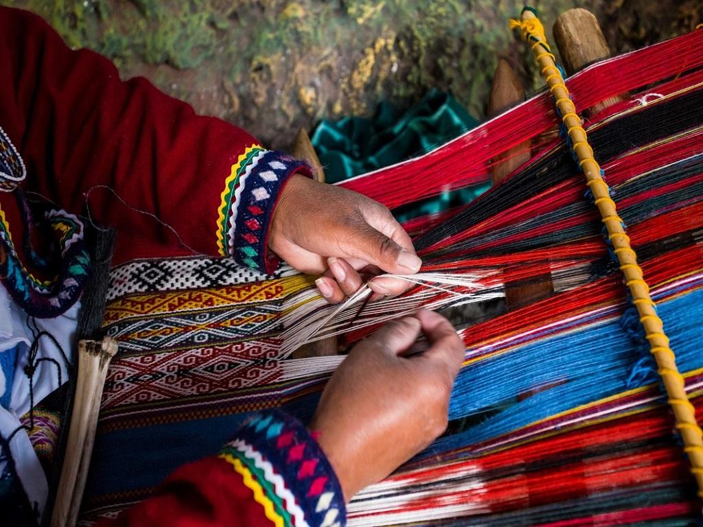 Traditional Aymara textile art displaying colorful geometric patterns and Indigenous craftsmanship.