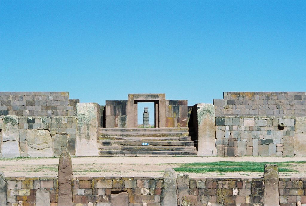Collage showing the evolution of Bolivian art from ancient Tiwanaku stone monuments to modern murals and Indigenous artistic traditions.
